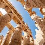 The sun's rays penetrate the columns in the Karnak temple.