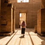 Woman walking in Temple of Philae aka Temple of Isis in Aswan Egypt,Agilkia Island