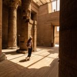 Woman walking in Temple of Philae aka Temple of Isis in Aswan Egypt,Agilkia Island