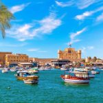 Alexandria harbour, boats near Qaitbay fort, point of the famous lighthouse, Egypt.