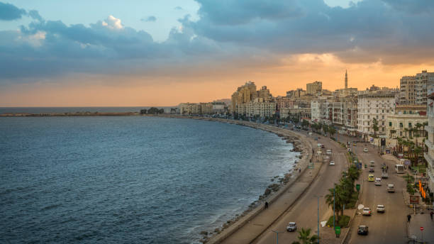 Alexandria, Egypt - November 15, 2018 :  

On the edge of the mediterranean sea, we find the corniche of alexandria. It is one of the main traffic corridors in the city and a wonderful walk especially at sunset. There are many hotels, restaurants and cafes along the corniche,  This cosmopolitan city has unequivocally a mythical aura.