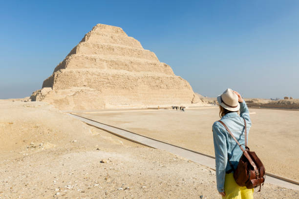 A young tourist at the Stepped Pyramid of Djoser, Saqqara. Egypt. The most important necropolis in Memphis. The first pyramid in the world