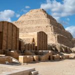 Djoser (or Djeser and Zoser) Step Pyramid, is an archaeological site in the Saqqara necropolis, Egypt, northwest of the ruins of Memphis. Built by Imhotep in the 27th century BC during the Third Dynasty for the burial of Pharaoh Djoser, the 6-tier, 4-sided structure is the earliest colossal stone building in Egypt. It is the central feature of a vast mortuary complex in an enormous courtyard surrounded by ceremonial structures and decoration.