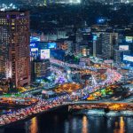 Night view of Cairo showing the Nile River, Hilton Hotel, Qasr El Nil Bridge and traffic jams.